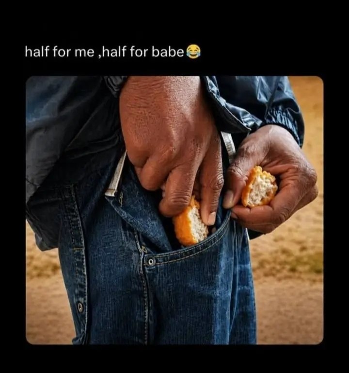 a man holding a piece of bread in his hands